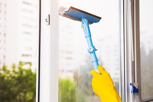 How often should windows be professionally cleaned for commercial properties?